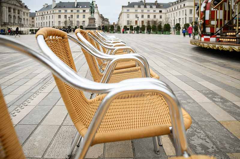 Wicker Chairs In The Main Square Of Orleans