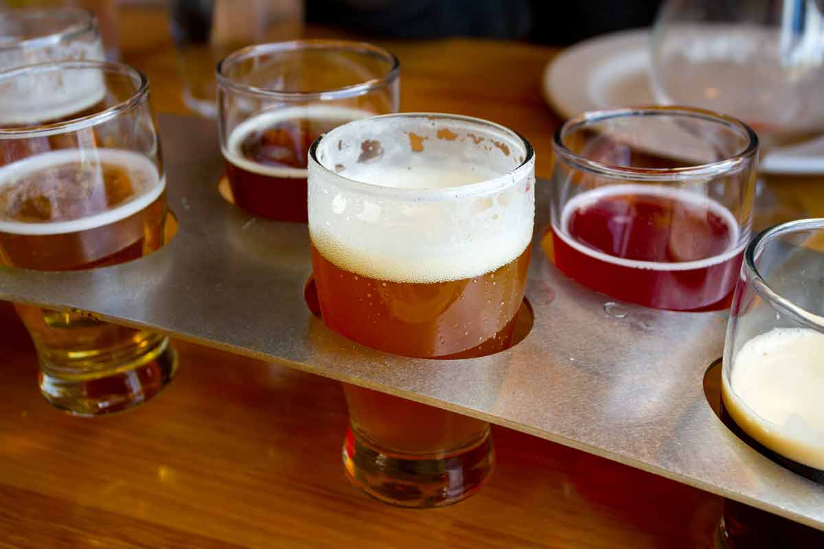 10 things to do in astoria oregon These craft microbrew beers are in a sampler tray at a brewery in Oregon.