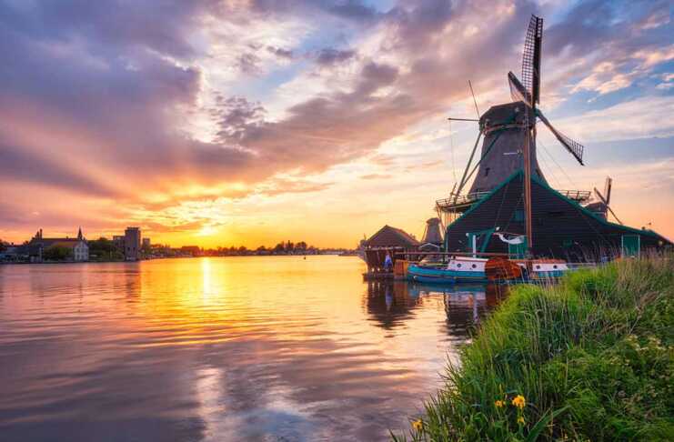 20 Amsterdam Itinerary Ideas For The Perfect Netherlands Trip Windmills At Zaanse Schans In Holland On Sunset.