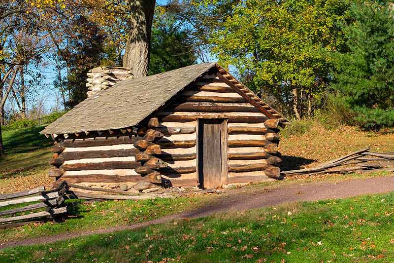 2 day trips from philadelphia A Reproduction Log Hut at Valley Forge National Historical Park.