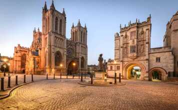 20 things to do in Bristol UK that make it seriously cool Cathedral and cobblestone square at night