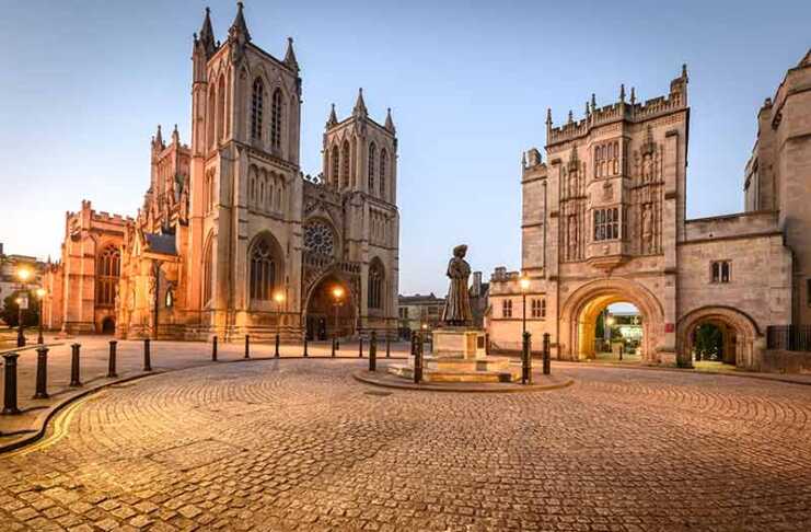 20 things to do in Bristol UK that make it seriously cool Cathedral and cobblestone square at night