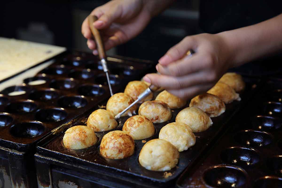 40 things to do in fukuoka takoyaki balls being cooked