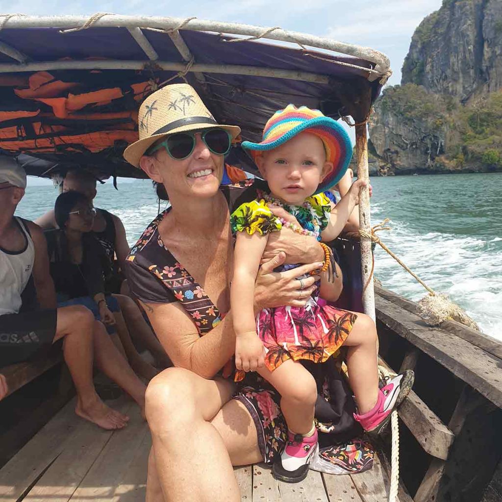 Woman and toddler on a boat in Ao nang