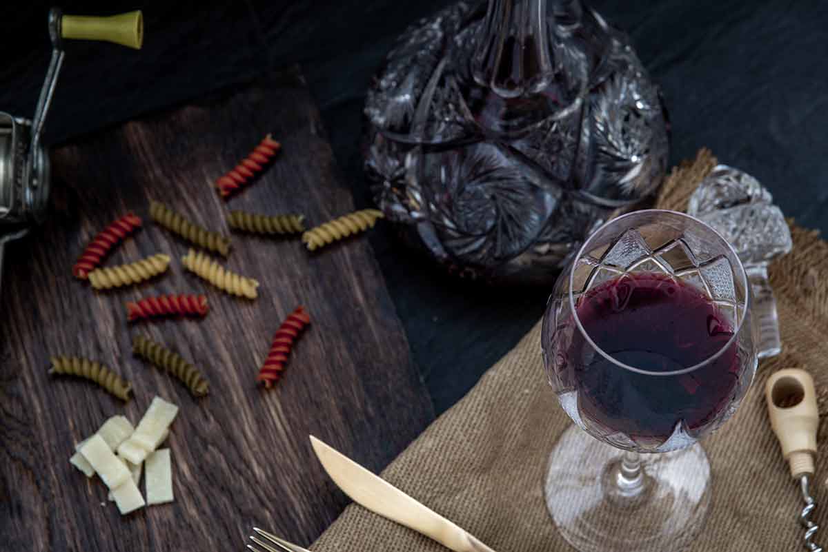 American drinks red wine Flat lay composition with pitcher and glasses of red wine and corkscrew on wooden background : traditional winemaking and wine tasting concept.
