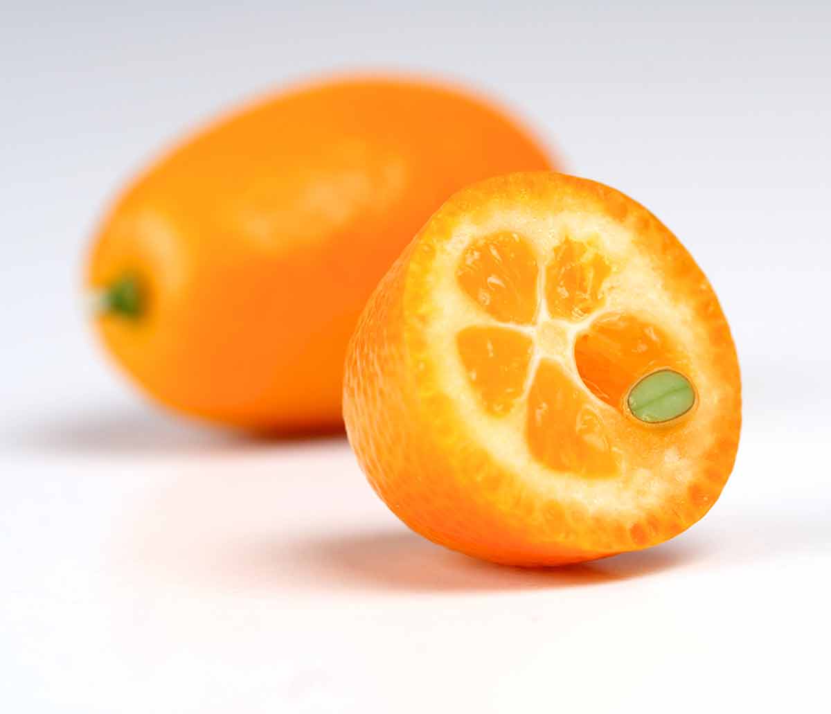 Kumquat on white background