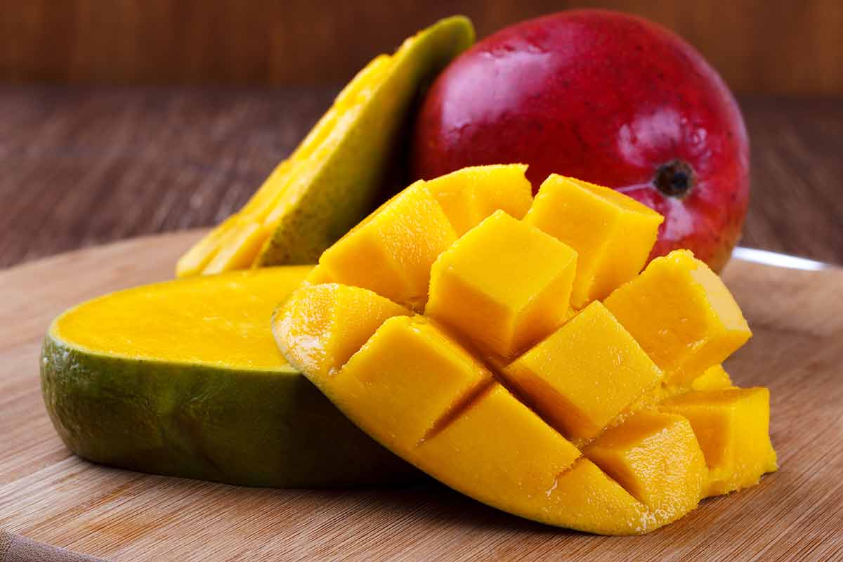 Fresh mango organic product on wooden background