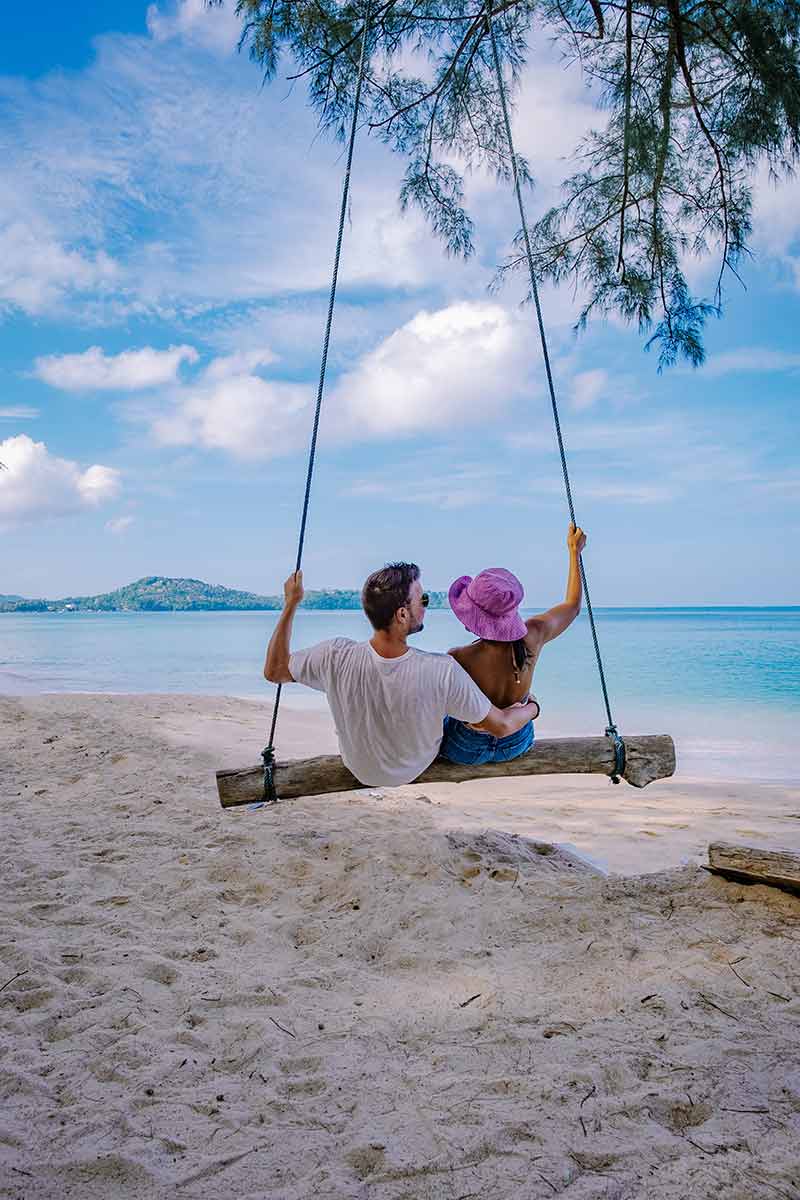 Couple on a swing at Bang Tao Beach Phuket