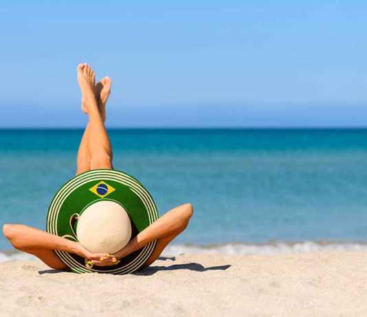 Beaches Brazil nude woman wearing a wide-brimmed hat with Brazil's flag
