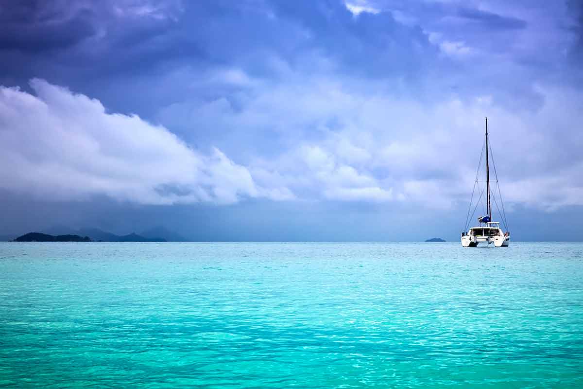 Beaches Venezuela blue sky emerald water and a catamaran