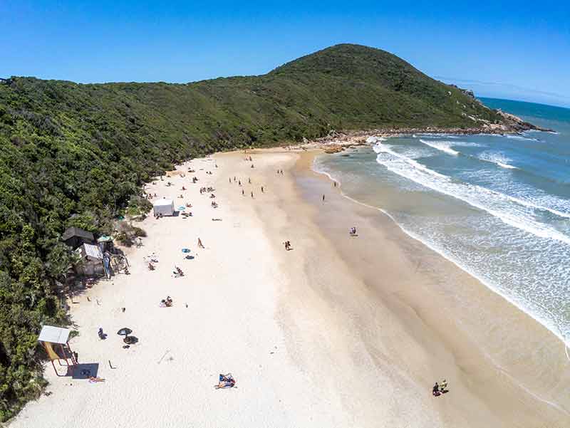 Beaches of Brazil (Praia do Rosa aerial view of wide beach with hill