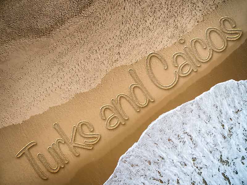 Beaches turks and caicos the words "Turks and Caicos' etched in the sand and seen from above