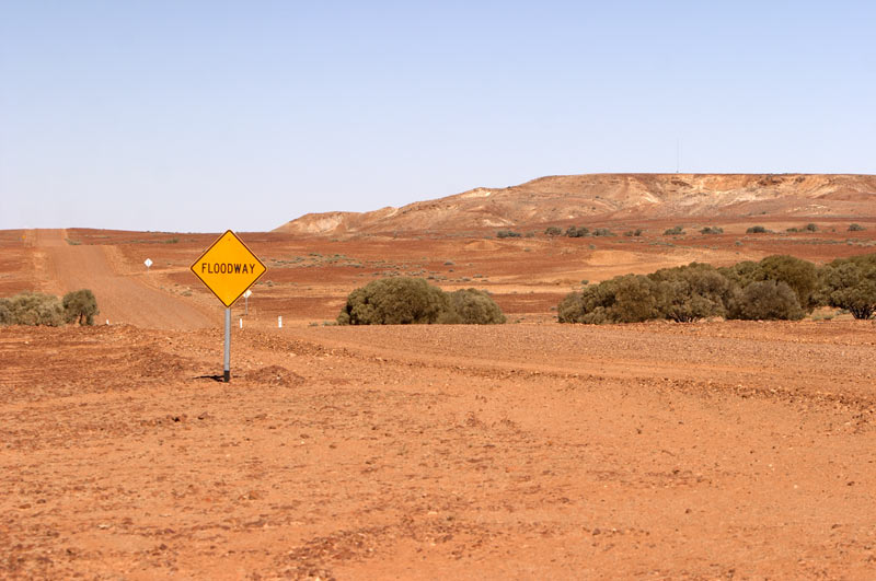 cooper pedy road and desert landscape