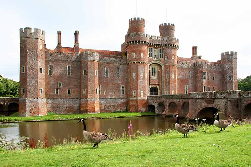 Castles in London (Herstmonceux Castle with ducks in foreground across the moat)