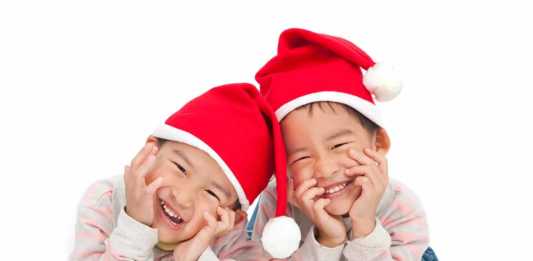 Christmas in China for kids two boys in santa hats