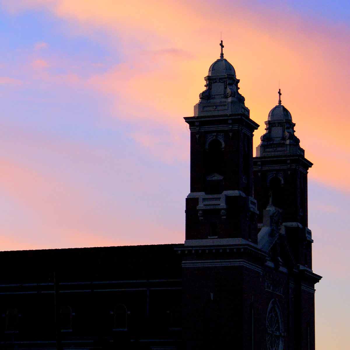 cathedral in thibodaux silhouetted against dawn sky