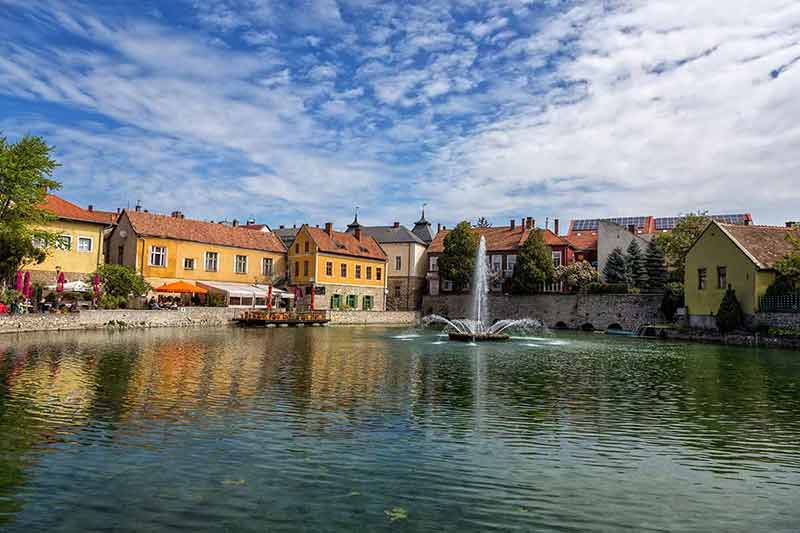 colourful buildings and lake in Tapolca (Hungary)