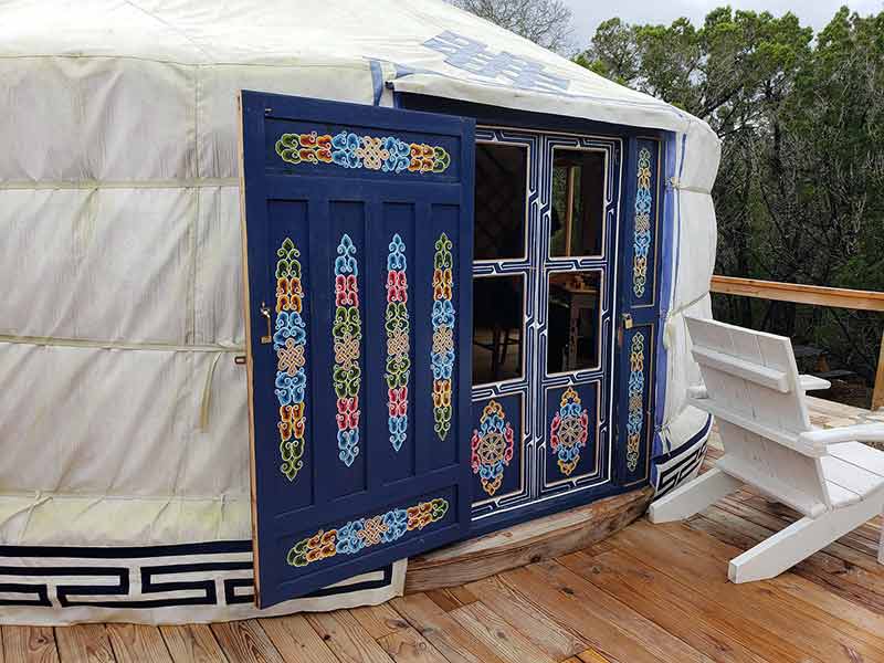 Glamping Texas yurtopia wimberley yurt with colourful door