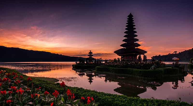 Ulun Danu reflected in the lake at sunset in Indonesia