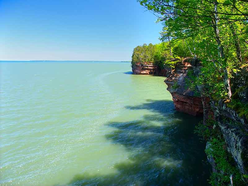 Lake Michigan Beaches Wisconsin rocky cliffs and lush green trees