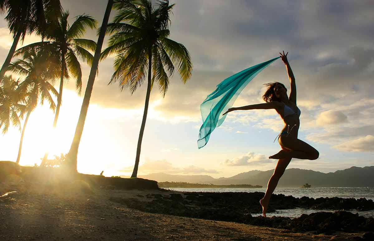 Las Gelaras Beach dominican republic woman in bikini dancing with a scarf