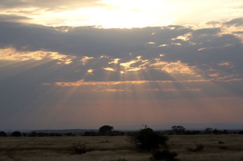 Great Rift Valley Kenya - Sun rays peeking through the late afternoon clouds