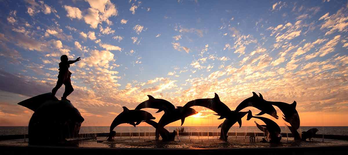 Mexico beaches to visit dolphin sculpture