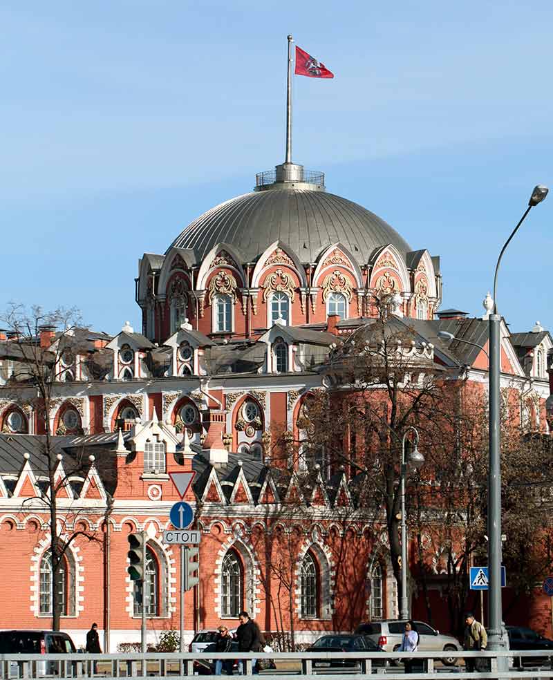Petrovsky palace in moscow with a flag on the dome