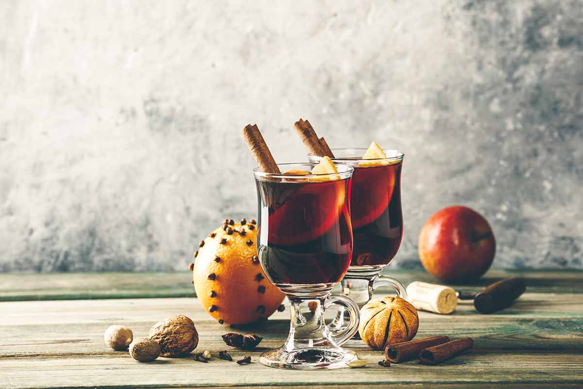 Polish drinks mulled wine with spices and orange slices on wooden table
