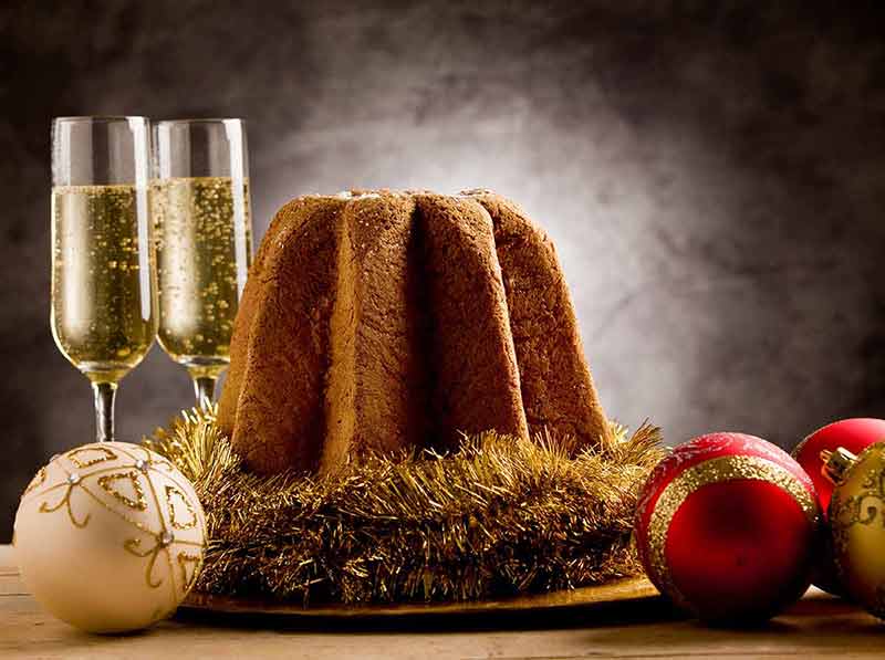 Rome in Christmas Italian panettone and two glasses of champagne