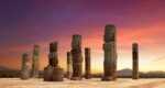 Ruins Of Tula columns against purple sky
