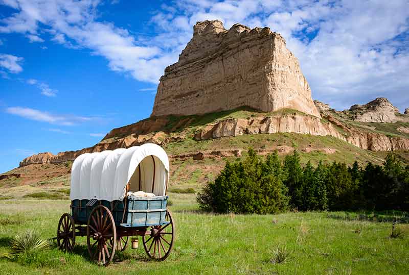 Scotts Bluff National Monument with wagon in front of it