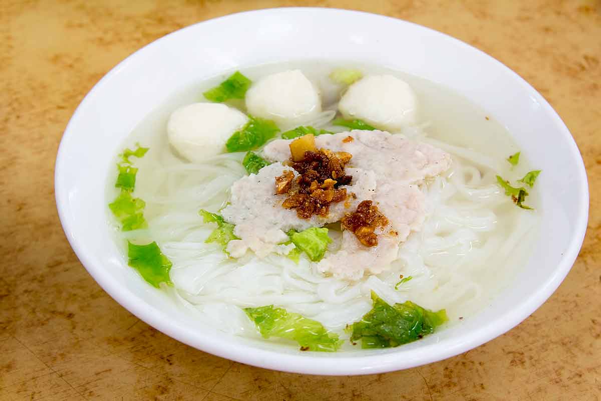 Singapore street noodles southeast Southeast Asian Fishball Noodle Soup with Pork Patty and Pork Lard Closeup