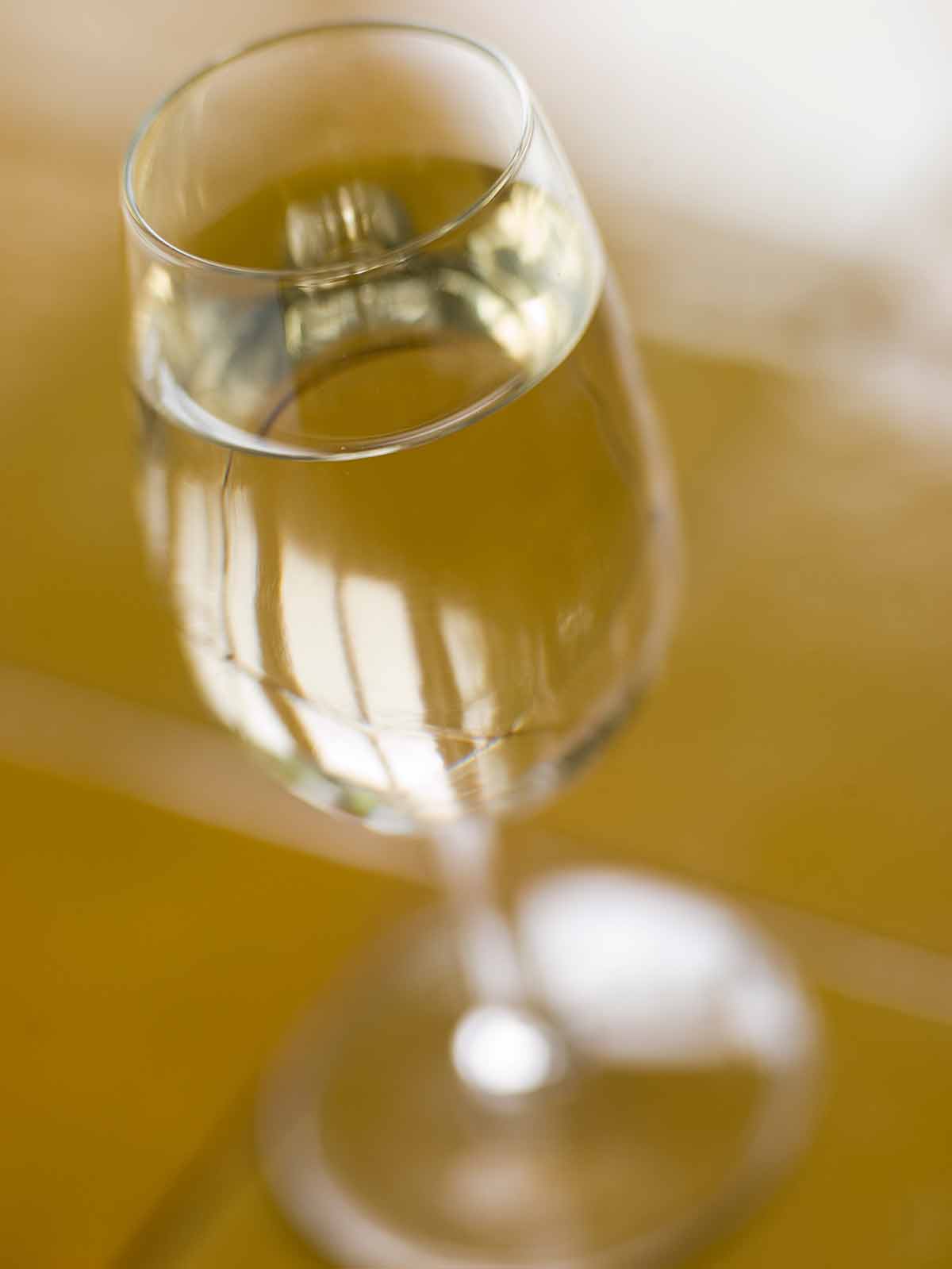 Spanish drinks dry sherry in a long-stemmed glass
