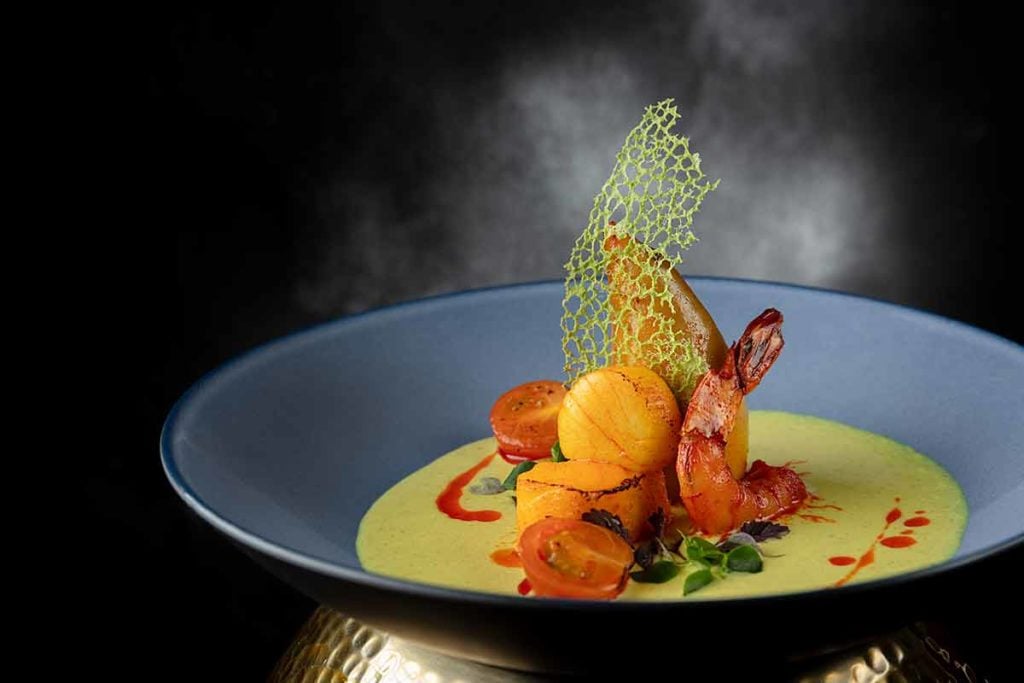 The Golden Peacock Crab, squid, Scottish Scallop, black cod, organic prawn, coconut paste海鮮大雜燴配魷魚釀蟹肉、香煎蘇格蘭带子、黑鱈魚及煎有機蝦配椰香汁