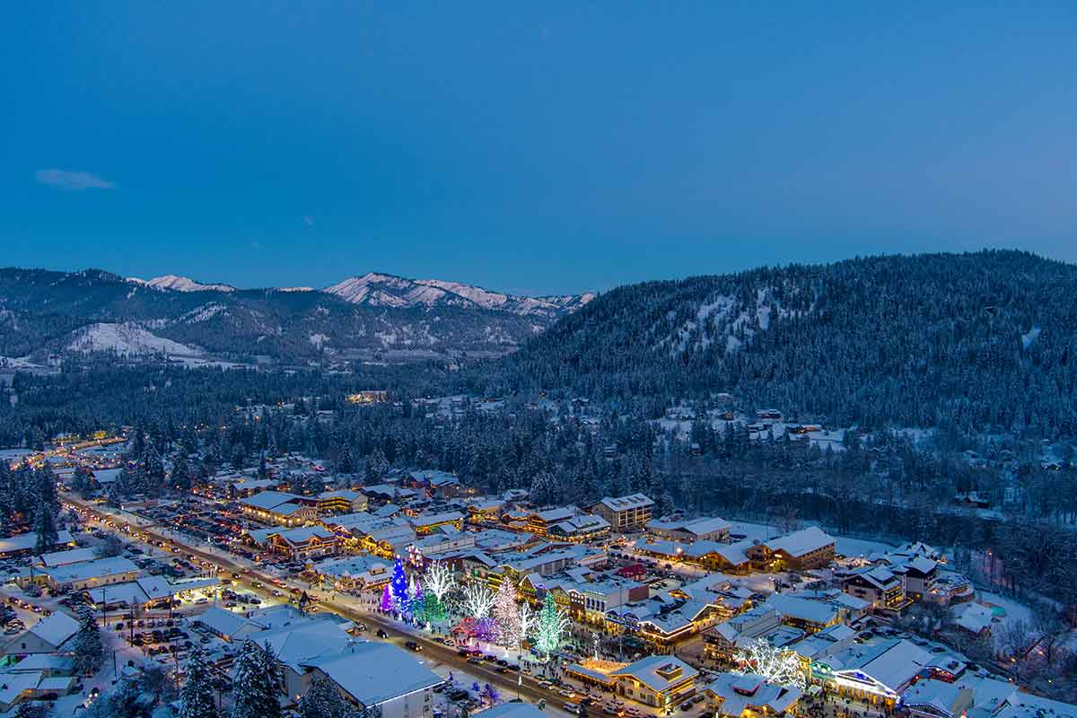aerial view of Leavenworth with snowcovered rooftops at night