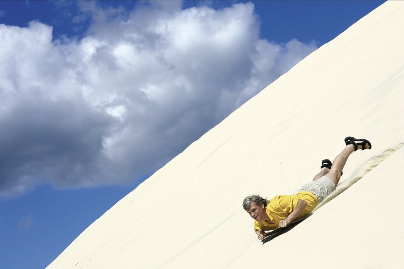 sand tobogganing is one of the fun things to do in queensland