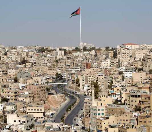 cityscape with Raghadan flagpole