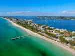20 Magical Things To Do on Anna Maria Island – Old Florida at Its Best! anna maria island cortez beach aerial view of beach, ocean and buildings