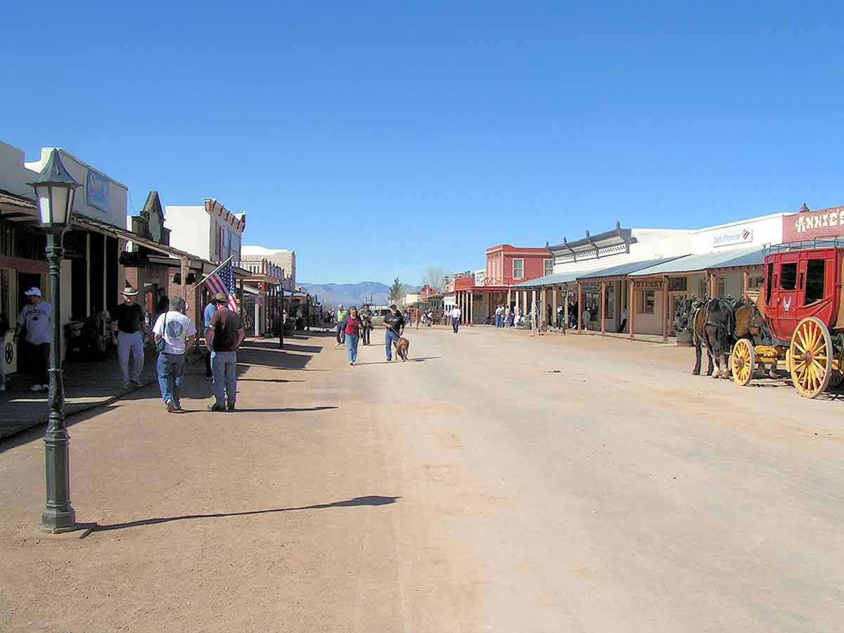 arizona ghost towns near tombstone wide street with people and horse and carriage