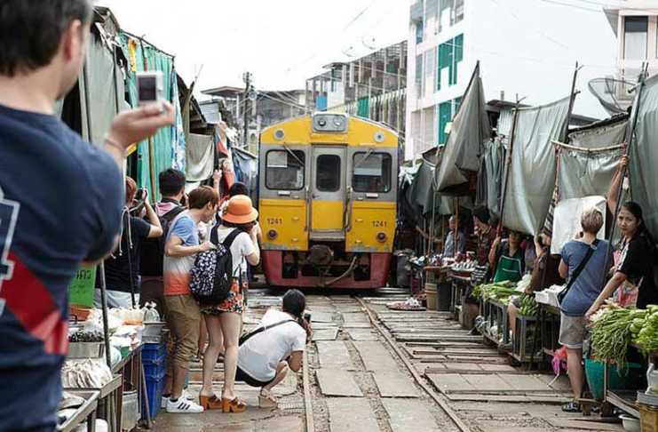 The Bangkok Market Where A Train Passes Through The Stalls Maeklong Railway Market