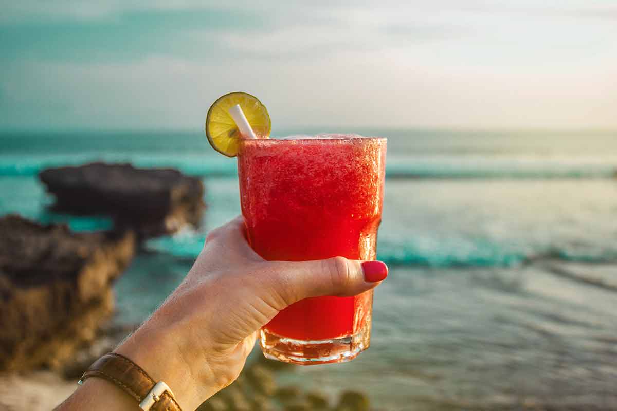 Hand With Watermelon Juice Cocktail On The Ocean