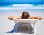 20 Incredible Beaches In India woman on lounge chair by the beach