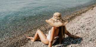 woman wearing a straw hat on the beach