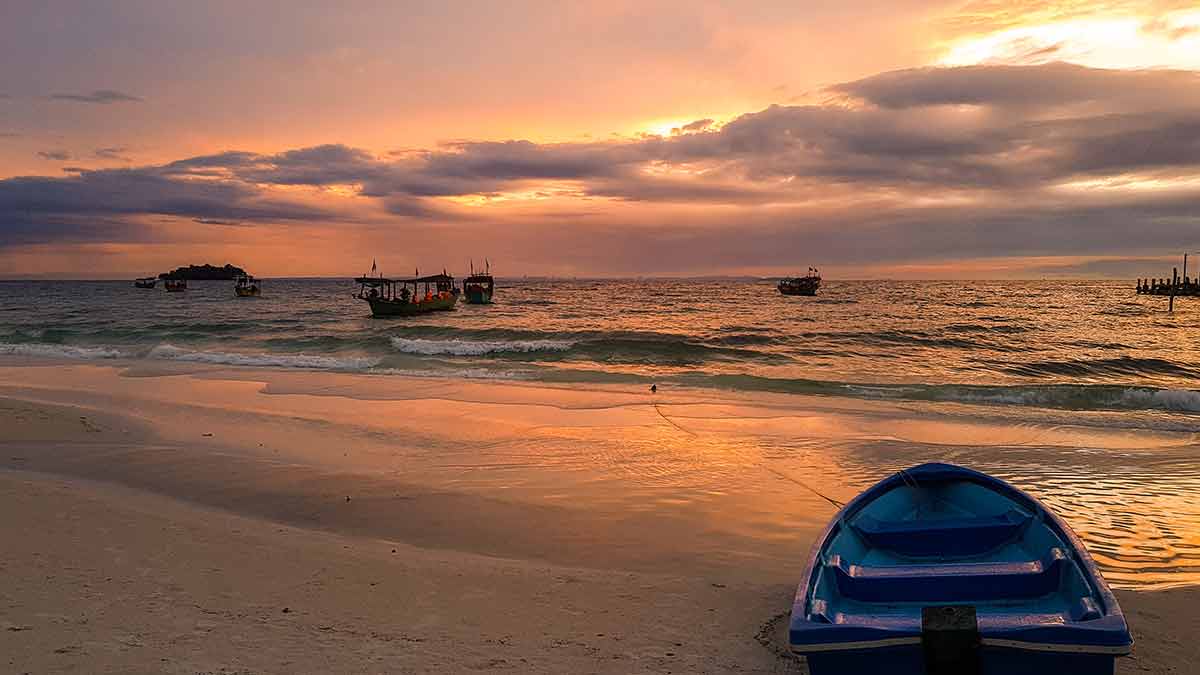 beaches near siem reap cambodia sunrise with a boat on the shore