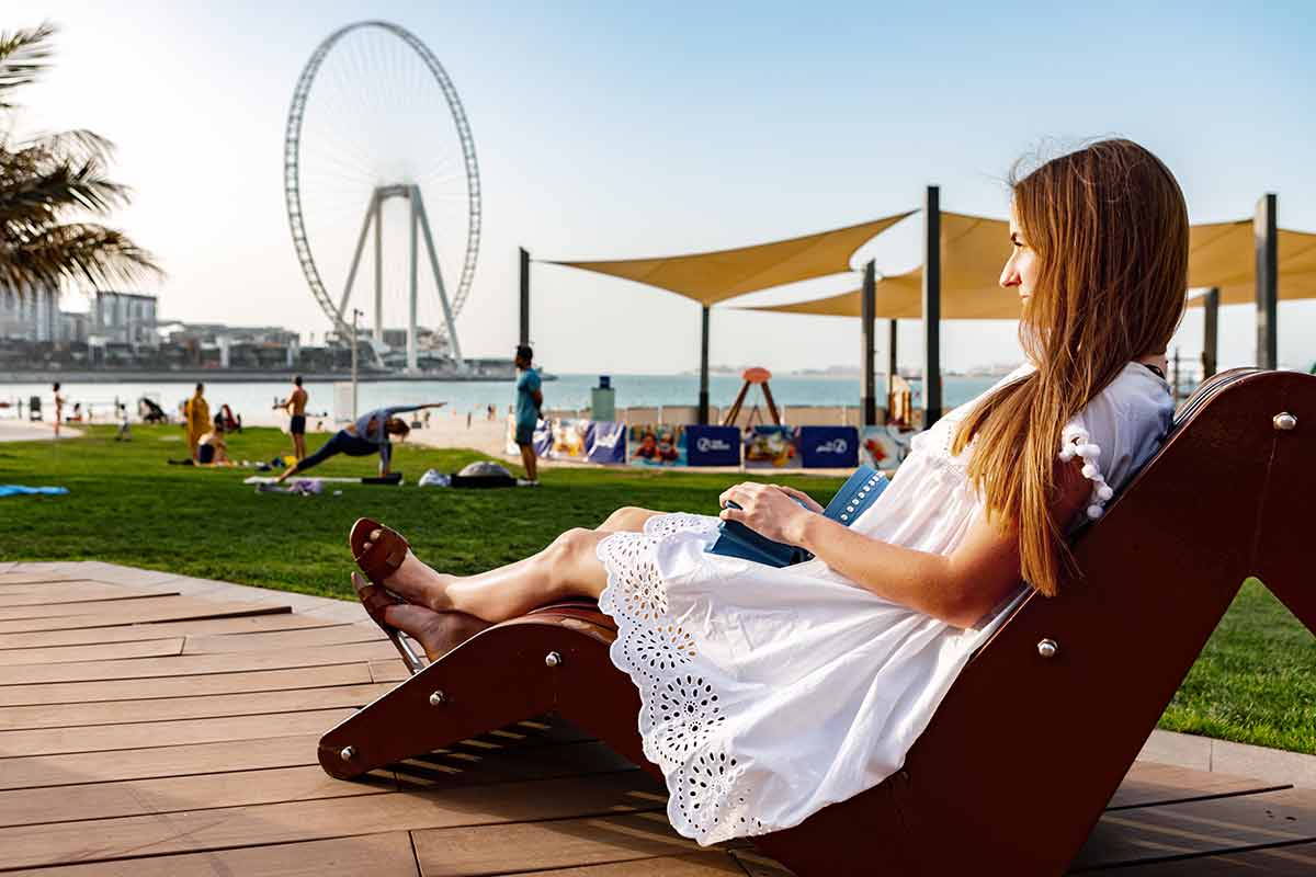 Woman Sitting On A Bench