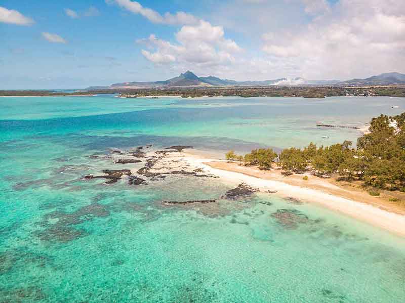 best beaches in mauritius Aerial view of beautiful tropical beach with turquoise sea.