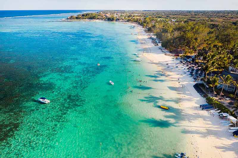 best beaches mauritius Flying over the turquoise lagoon of Mauritius in the Belle Mare area