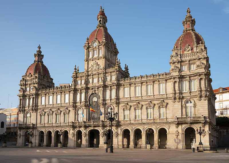 best cities in spain to visit townhall on a blue-sky day