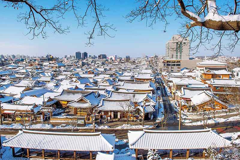 Roof Of Jeonju Traditional Korean Village Covered With Snow